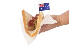 hand-offering-what-termed-sausage-sizzle-often-australian-fund-raiser-charity-sausage-sizzle-tradition-113399963.jpg